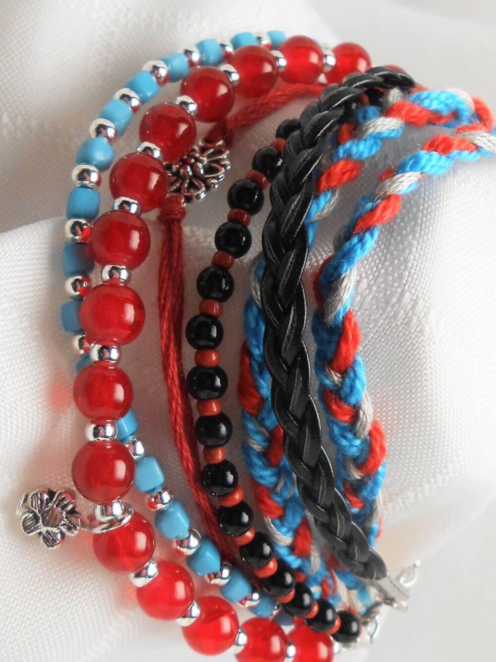 Handmade bracelet with rows of threads, beads, and charms No.234